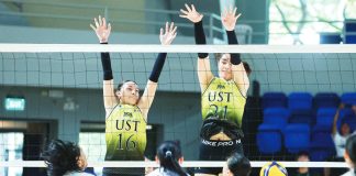 Erin Sotto of University of Santo Tomas Junior Golden Tigresses foils an attack from Ateneo de Manila University Blue Eaglets. UAAP PHOTO