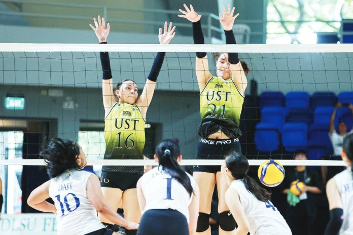 Erin Sotto of University of Santo Tomas Junior Golden Tigresses foils an attack from Ateneo de Manila University Blue Eaglets. UAAP PHOTO