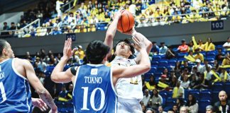 University of Santo Tomas Growling Tigers guard Isaac Danting pulls up for a jumper against Ateneo Blue Eagles’ Shawn Tuano during their triple-overtime showdown. UAAP PHOTO