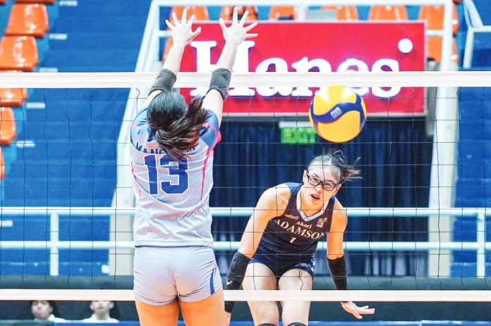 Adamson University Lady Falcons’ Shaina Nitura fires against the defense of Arellano University Lady Chiefs. PHOTO COURTESY OF V-LEAGUE