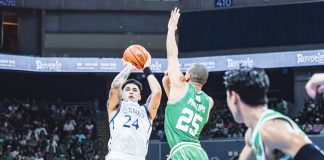 Ateneo de Manila University Blue Eagles’ Dom Escobar pulls up a shot against the defense of De La Salle University Green Archers' Michael Phillips. UAAP PHOTO