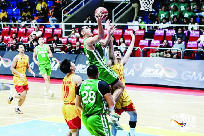 Allen Liwag of the College of St. Benilde Blazers drives to the basket against the San Sebastian College-Recoletos Golden Stags during their NCAA clash at the Playtime FilOil Center in San Juan. PHOTO BY NCAA/GMA SPORTS