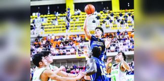 National University Bulldogs’ Jake Figueroa scores a one-hander against the defense of De La Salle University Green Archers. UAAP PHOTO
