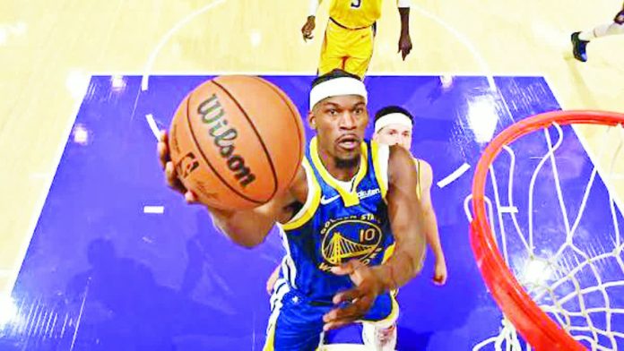 Golden State Warriors guard Jimmy Butler III attacks the basket for a layup. NBA PHOTO