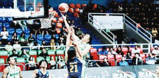 Negrense Raffy Celis of College of St. Benilde Blazers goes for an inside hit against the Jose Rizal University Heavy Bombers’ defense. Photo by NCAA/GMA Sports