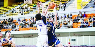 National University’s Jake Figueroa powers his way to the basket against Ilonggo Ian Espinosa of Ateneo de Manila University during their UAAP Season 88 clash at the UST Quadricentennial Pavilion. UAAP PHOTO