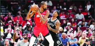 Houston Rockets forward Kevin Durant seizes up the defense of Brooklyn Nets guard Terance Mann. AP