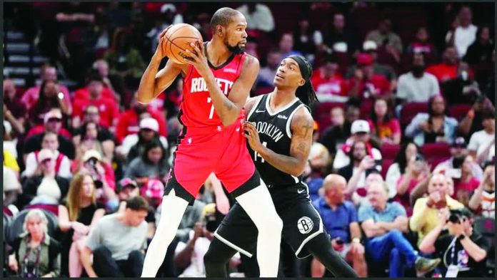 sports_Houston.JPG_resized_compressed Houston Rockets forward Kevin Durant seizes up the defense of Brooklyn Nets guard Terance Mann. AP