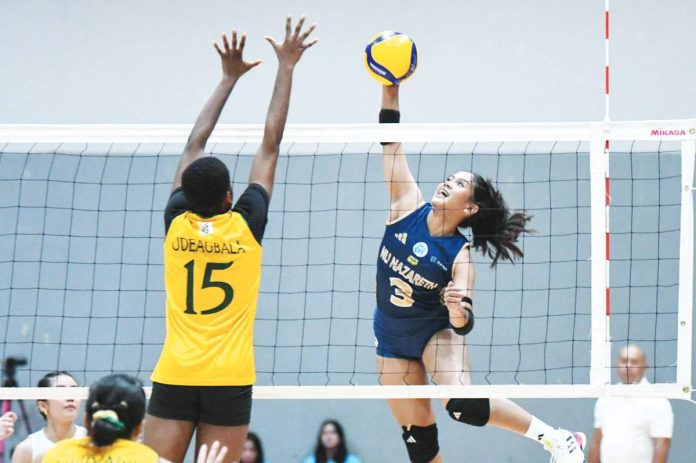 sports_Lady_resized Negrense Diza Berayo of the National University – Nazareth School Lady Bullpups tries to score against the defense of Far Eastern University – Diliman Lady Baby Tamaraws. UAAP PHOTO