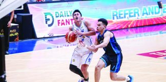 TNT Tropang 5G’s Rey Nambatac rises for the game-winning jumper against Meralco Bolts’ Chris Banchero during their PBA Philippine Cup clash at the Ynares Center. PBA PHOTO