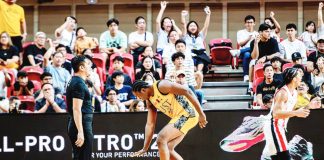University of Santo Tomas Growling Tigers' Collins Akowe gestures after scoring against University of the East Red Warriors. UAAP PHOTO