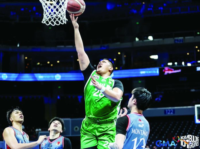 Shawn Umali of College of Saint Benilde Blazers scores inside against his former team Lyceum Pirates. PHOTO BY NCAA/GMA SPORTS