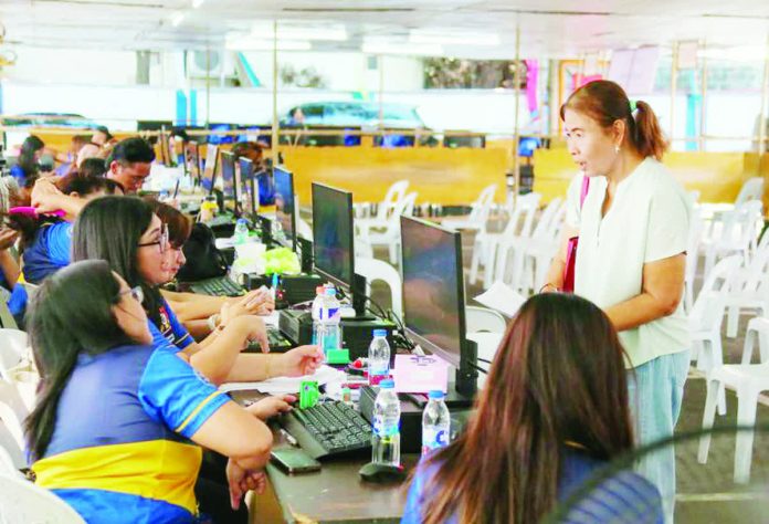 tax_collection_copy_resized_compressed A filer is seen the Bureau of Internal Revenue (BIR) Revenue Region 8B South NCR in Makati City in this filephoto. The BIR expects less on-site filers as many have opted to file their Income Tax Returns online. MARK DEMAYO/ ABS-CBN NEWS PHOTO
