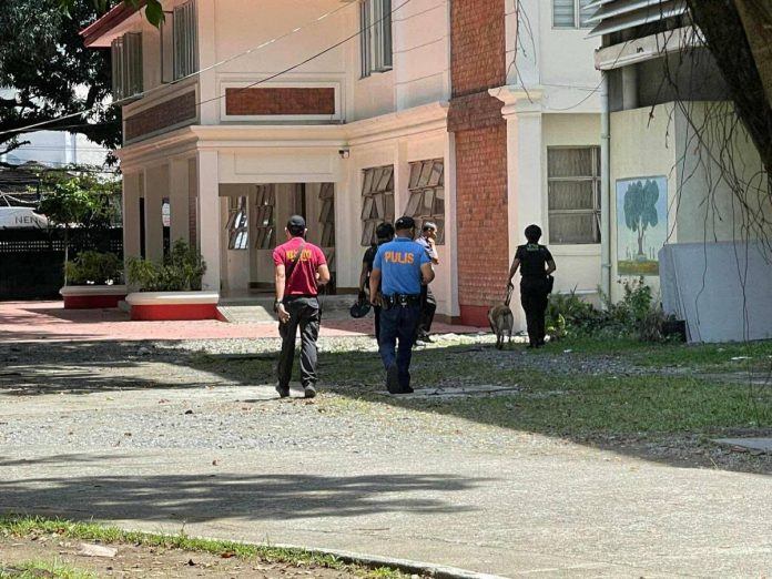 Personnel from the Iloilo City Police Office and PRO6 EOD inspect the UP Visayas Iloilo City campus on October 2 following a bomb threat. The campus was declared safe by early afternoon. PRO-6 PHOTO