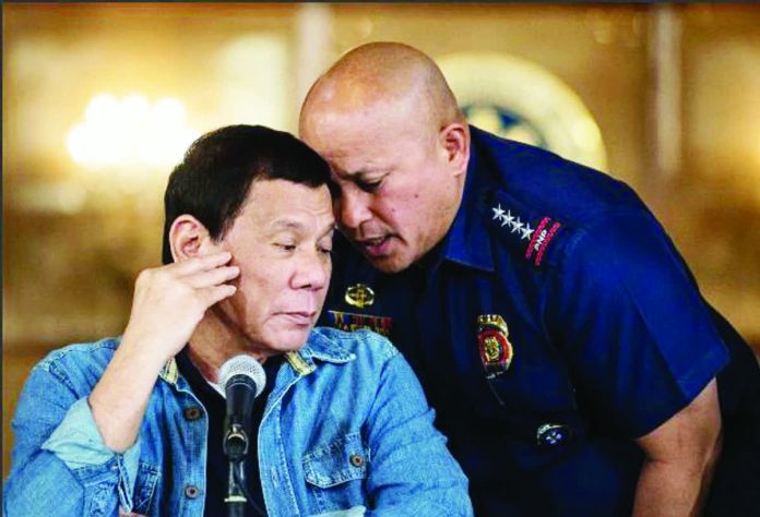 Sen. Ronald “Bato” Dela Rosa (right), who led the Philippine National Police from 2016 to 2018, oversaw former president Rodrigo Duterte’s bloody war on drugs — the centerpiece of the International Criminal Court probe launched in 2018 to determine possible crimes against humanity linked to thousands of killings during the campaign. AFP