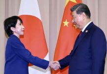 China urges citizens not to visit Japan over Taiwan row Japanese prime minister Sanae Takaichi (left) shakes hands with Chinese President Xi Jinping in front of the Japanese and Chinese flags in South Korea on October 31. KYODO VIA REUTERS