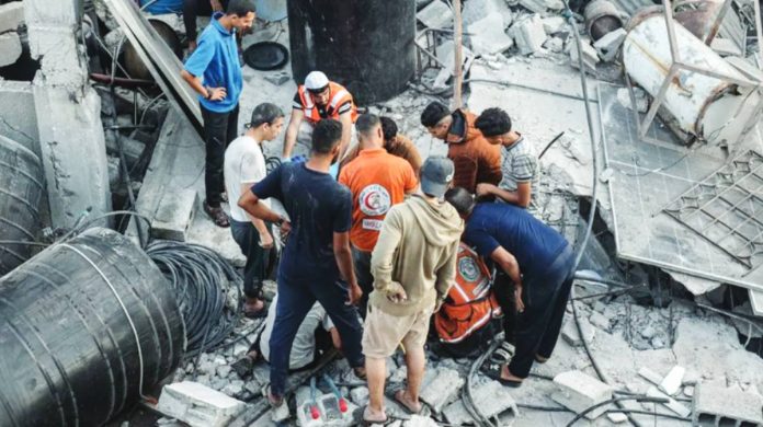 Gaza Rescuers gather as four people are killed in an Israeli strike in Nuseirat refugee camp, in central Gaza Strip. BBC