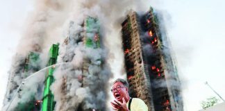 A man screams in anguish while a massive blaze consumes multiple high-rise blocks at the Wang Fuk Court housing estate in Tai Po, Hong Kong, on Nov. 26, 2025. Authorities later confirmed over 40 fatalities and hundreds unaccounted for in one of the city’s deadliest fires in recent years. The Philippines’ Department of Foreign Affairs says the Philippine Consulate General in Hong Kong received unverified information that some Filipino domestic workers may be trapped inside the buildings. REUTERS PHOTO