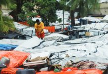 At least 20 dead in Haiti as Hurricane Melissa hits A man inspects plastic sheets serving as roofs for makeshift homes during heavy rains brought by Hurricane Melissa, at a Church of Jesus Christ of Latter-day Saints shelter, in Port-au-Prince, Haiti, on October 29, 2025. REUTERS