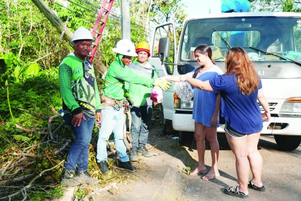 Several consumers provided snacks to Negros Power linemen who were busy working to bring power at Charito Heights Subdivision, Barangay Granada, Bacolod City.