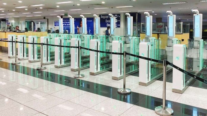 NAIA_e-gates_resized Biometric e-gates installed at Ninoy Aquino International Airport Terminal 3 are set to begin activation in December 2025. NEW NAIA INFRA CORP. PHOTO