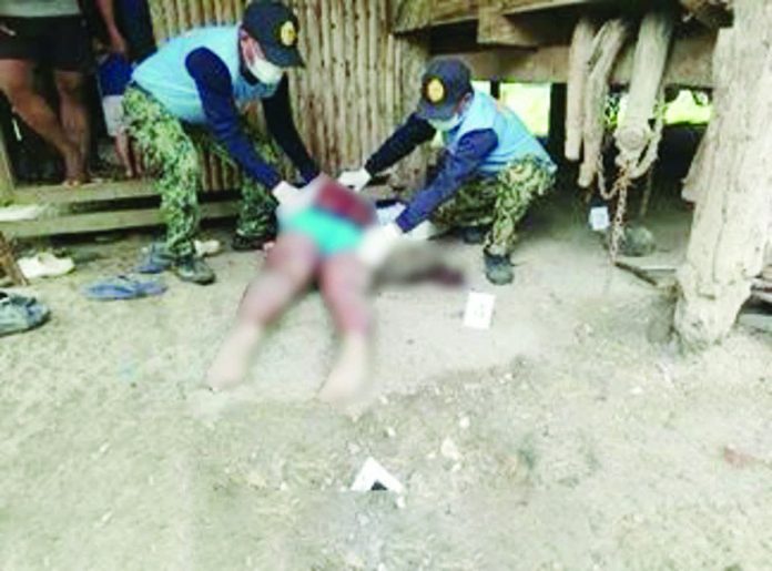 PRO-NIR_resized_compressed The lifeless body of a barangay kagawad, reportedly an active member of an anti-communist organization, lies outside his home after he was shot dead early Monday morning, November 3, in Barangay Tambad, Cauayan, Negros Occidental. PRO-NIR PHOTO