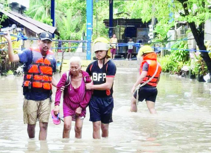 Verbena in Bacolod copy_compressed Bureau of Fire Protection (BFP) Bacolod personnel rescued a senior citizen and 15 families in Purok Fatima Dos, Barangay Sum-ag, after they were stranded by heavy rains and flooding caused by Tropical Depression “Verbena” on November 25. BFP-BACOLOD PHOTO