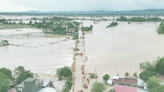 agri_damage_copy_resized This aerial handout photo taken on November 10, 2025 and released by the Cagayan Provincial Information Office shows rescuers making their way through floodwaters to reach flooded homes at a village in Tuao, Cagayan province, after a river overflowed due to heavy rains brought by Super Typhoon “Uwan.” HANDOUT/CAGAYAN PROVINCIAL INFORMATION OFFICE/AFP