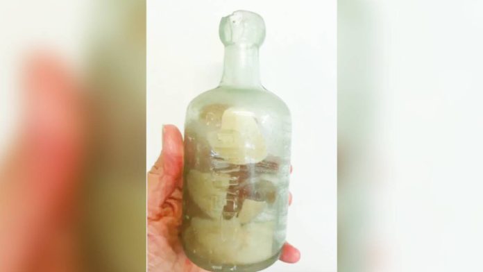 bottle This old glass bottle contains a paper with a message written more than a hundred years ago. DEB BROWN VIA AP