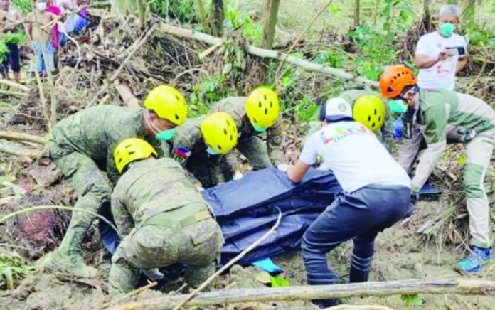 govt_troops_resized_compressed Troops of the 53rd Engineering Brigade of the Philippine Army’s 3rd Infantry Division (3ID) conduct retrieval operations in Purok 8, Barangay Cabadiangan in Compostela, Cebu in this photo released on Thursday, Nov. 20, 2025. The 3ID assured they will stay in Cebu until it has fully recovered from the effects of Typhoon “Tino”. PHOTO COURTESY OF 3ID