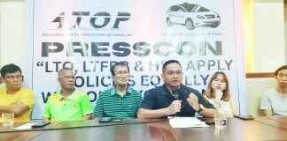 Atty. Bjorn Denfield Hudierez (4th from left), legal counsel of local taxi operators in Panay Island, speaks during a press conference calling on the Land Transportation Franchising and Regulatory Board and the Land Transportation Office to act on the operators’ complaints regarding the operation of newcomer blue taxis. With him are officials of local taxi alliances.