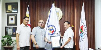 Department of Interior and Local Government - Region 6 director Juan Jovian Ingeniero, joined by DILG Iloilo Province Cluster Head Raymundo Palanog, turns over the Regional Peace and Order Council flag and certificate of appointment to Gov. Arthur Defensor Jr. on November 18, 2025.