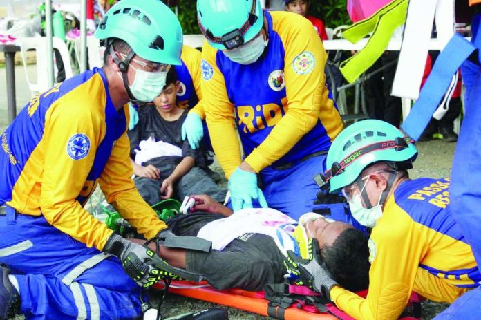 Passi City responders demonstrate their vehicular extrication skills during the 1st Iloilo Disaster Risk Reduction and Management Operational Readiness Simulation Exercises held on Nov. 29, 2025. PHOTO FROM ILOILO POLICE PROVINCIAL OFFICE FACEBOOK