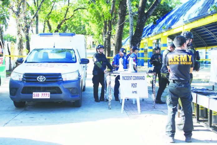The Philippine National Police sets up a command post at Guimbal National High School in Guimbal town after it received a bomb threat on Monday, Nov. 17, 2025. “We are offering P100,000 reward for any useful information that could effectively or lead to something concrete in the identification and arrest of those behind the recent bomb threats,” Gov. Arthur Defensor Jr. says. AJ PALCULLO/PN