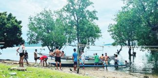 Fisherfolk from Barangay Nipa, San Dionisio, Iloilo are seen hauling their boats inland ahead of the expected landfall today of Typhoon Tino. JERLYN BATOGON FB PHOTO