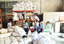 Volunteer police personnel assist the Office of Civil Defense - Region 6 in packing and dispatching relief goods and rice supplies for communities hit hard by typhoons “Ramil”, “Tino” and “Uwan” across Western Visayas these past two months. OCD-6 PHOTO