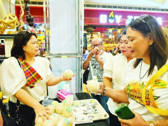neljoy_Panublion_copy_resized_compressed Coconut-based products attract curiosity during the Department of Trade and Industry-organized Panublion 2025. The fair highlighted the creativity, craftsmanship, and innovation of Western Visayas’ micro, small, and medium enterprises, featuring locally made products from Aklan, Antique, Capiz, Guimaras, Iloilo, and Negros Occidental. DTI-6 PHOTO