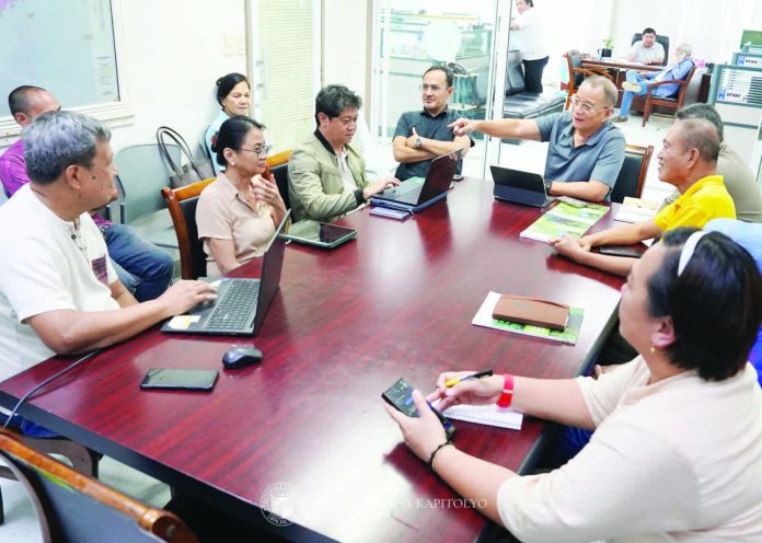 neljoy_nature-based_copy_resized_compressed Provincial Administrator Raul Banias (third from right) leads a round-table discussion with environmental advocates and Iloilo provincial government officials on integrating nature-based solutions and the ridge-to-reef strategy into sustainable development programs. The consultation aims to align infrastructure planning with climate resilience, ecological restoration, and disaster preparedness initiatives. PHOTO FROM BALITA HALIN SA KAPITOLYO