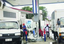 Gasoline station workers attend to clients in Barangay Mali-ao, Pavia, Iloilo, on Monday, Nov. 24, 2025. Gasoline and diesel prices are going up this week. PN PHOTO