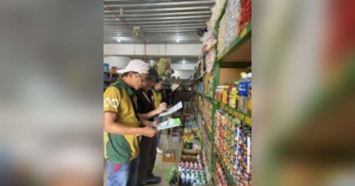 retailers on price freeze.JPG_superimposed_compressed A team from the Department of Trade and Industry (DTI) in Negros Oriental inspects a major retailer in Canlaon City to check compliance on the 60-day price freeze on basic goods. Around 99.92 percent of establishments nationwide that were monitored for compliance heeded it, the DTI said. PHOTO COURTESY OF DTI-NEGROS ORIENTAL