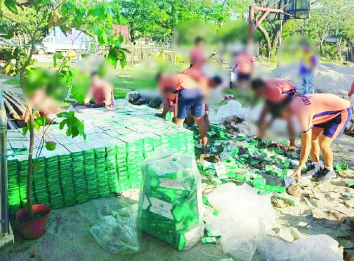 Around 100 boxes of assorted smuggled cigarettes were seized by the Philippine Coast Guard–Southern Negros Occidental at the old port in Barangay Cartagena, Sipalay City, Negros Occidental, on Nov. 27, 2025. COAST GUARD DISTRICT SOUTHERN VISAYAS PHOTO