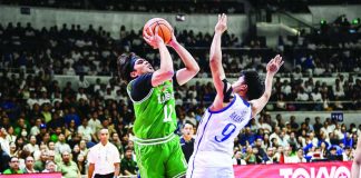 De La Salle University’s Jacob Cortez rises for a shot against Ateneo’s Jared Bahay during their rivalry duel at the Smart Araneta Coliseum. UAAP PHOTO