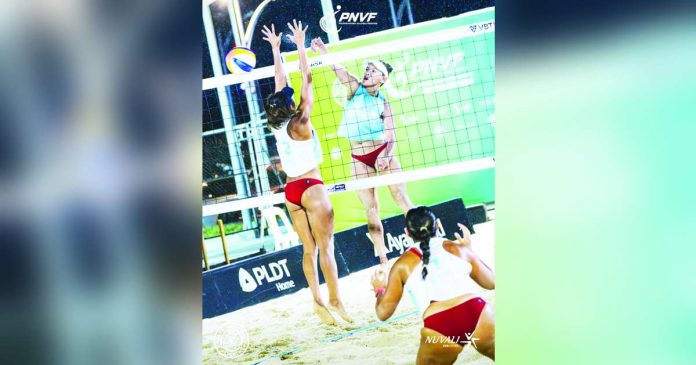 sports Rondina_superimposed Cherry Rondina rises for a kill against her defender during the PNVF Beach Volleyball Invitational. BVR PHOTO