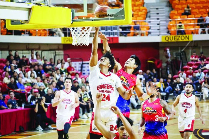 sports_Abarrientos_resized_compressed Barangay Ginebra’s Jayson David eludes Phoenix star Ricci Rivero for a layup. PBA PHOTO