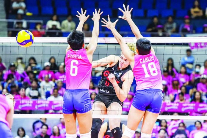 sports_Angels_resized_compressed Lindsey Vander Weide of Petro Gazz Angels smashes the ball against the defense of Creamline’s Diana Carlos and Jeanette Panaga. PVL PHOTO