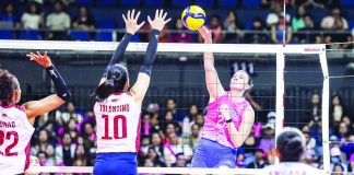 Creamline Cool Smashers’ Courtney Schwan rises for a kill against the outstretched arms of Choco Mucho’s Kat Tolentino. PVL PHOTO