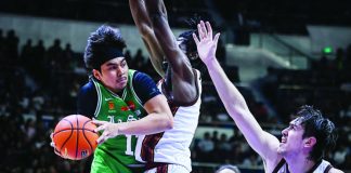 De La Salle University Green Archers' Jacob Cortez was met with the defense of University of the Philippines Fighting Maroons' Francis Nnoruka. UAAP PHOTO