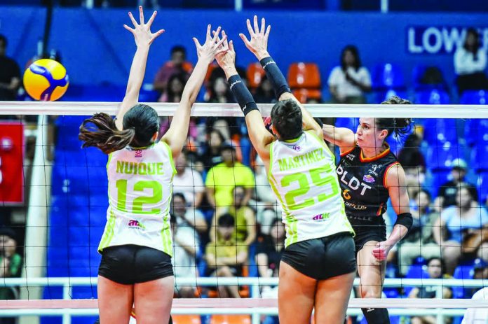 PLDT High Speed Hitters’ Savannah Davison scores against Nxled Chameleons’ Paola Martinez and Mayang Nuique during their PVL Reinforced Conference match. PVL PHOTO