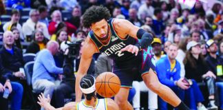 Detroit Pistons guard Cade Cunningham (2) drives over Indiana Pacers guard Andrew Nembhard (2) during the first half of an NBA basketball game in Indianapolis. AP