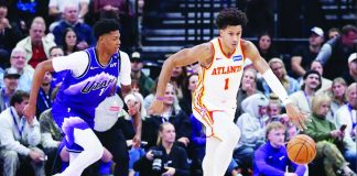Atlanta Hawks forward Jalen Johnson (1) dribbles against Utah Jazz guard Ace Bailey (19). PHOTO COURTESY OF ROB GRAY-IMAGN IMAGES